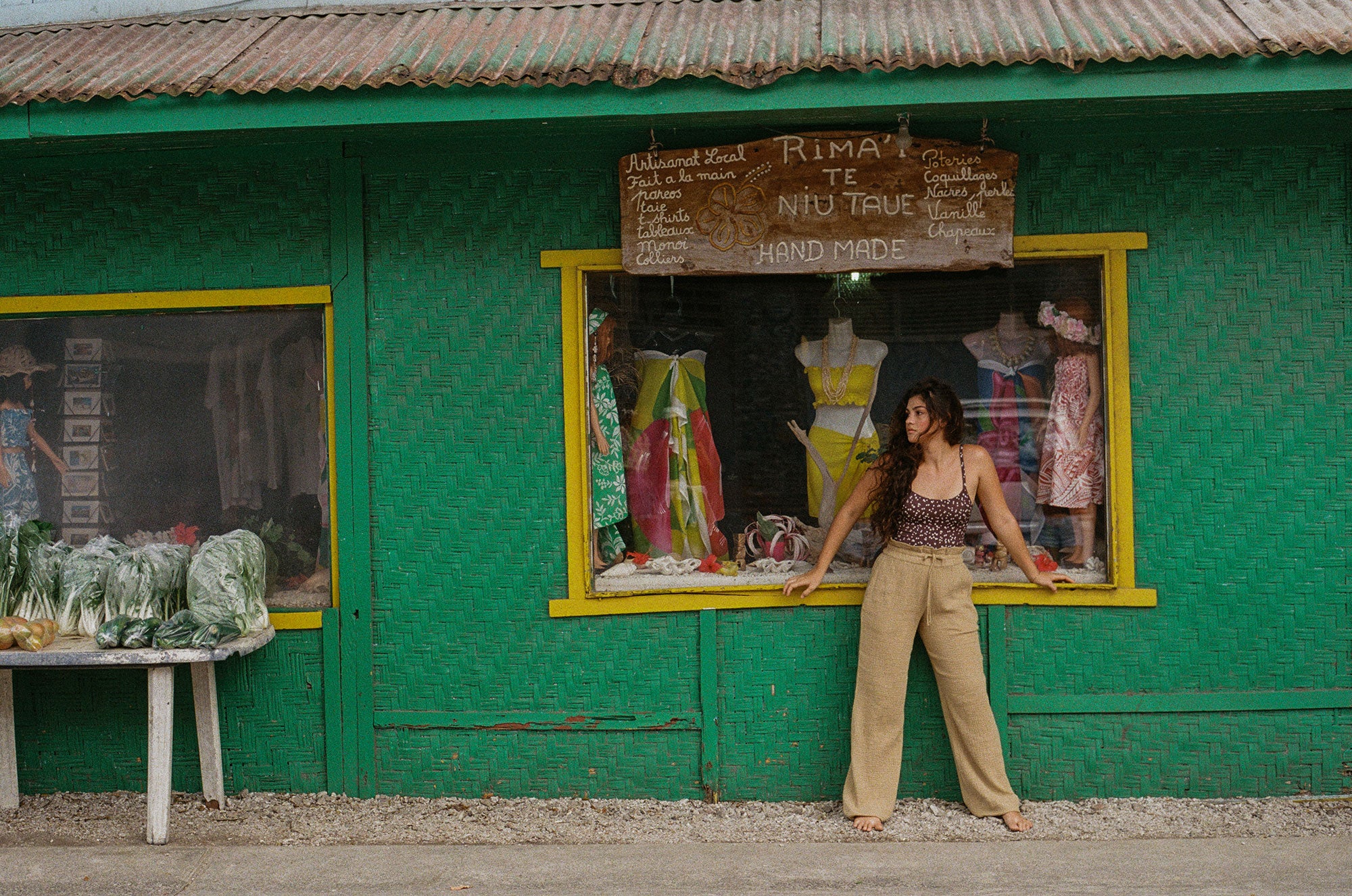 Girl in front of a green shop