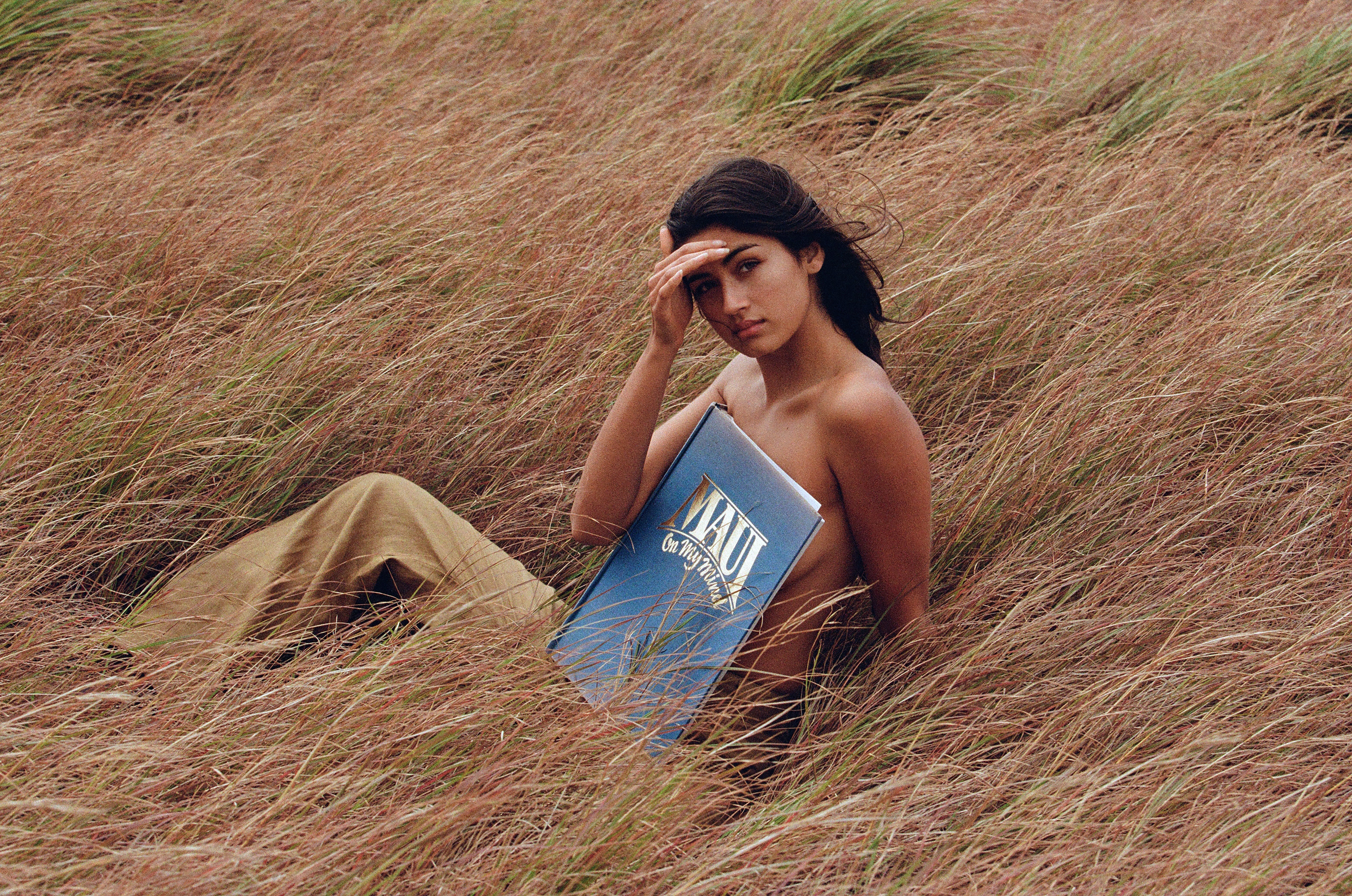 girl in grass in linen pants