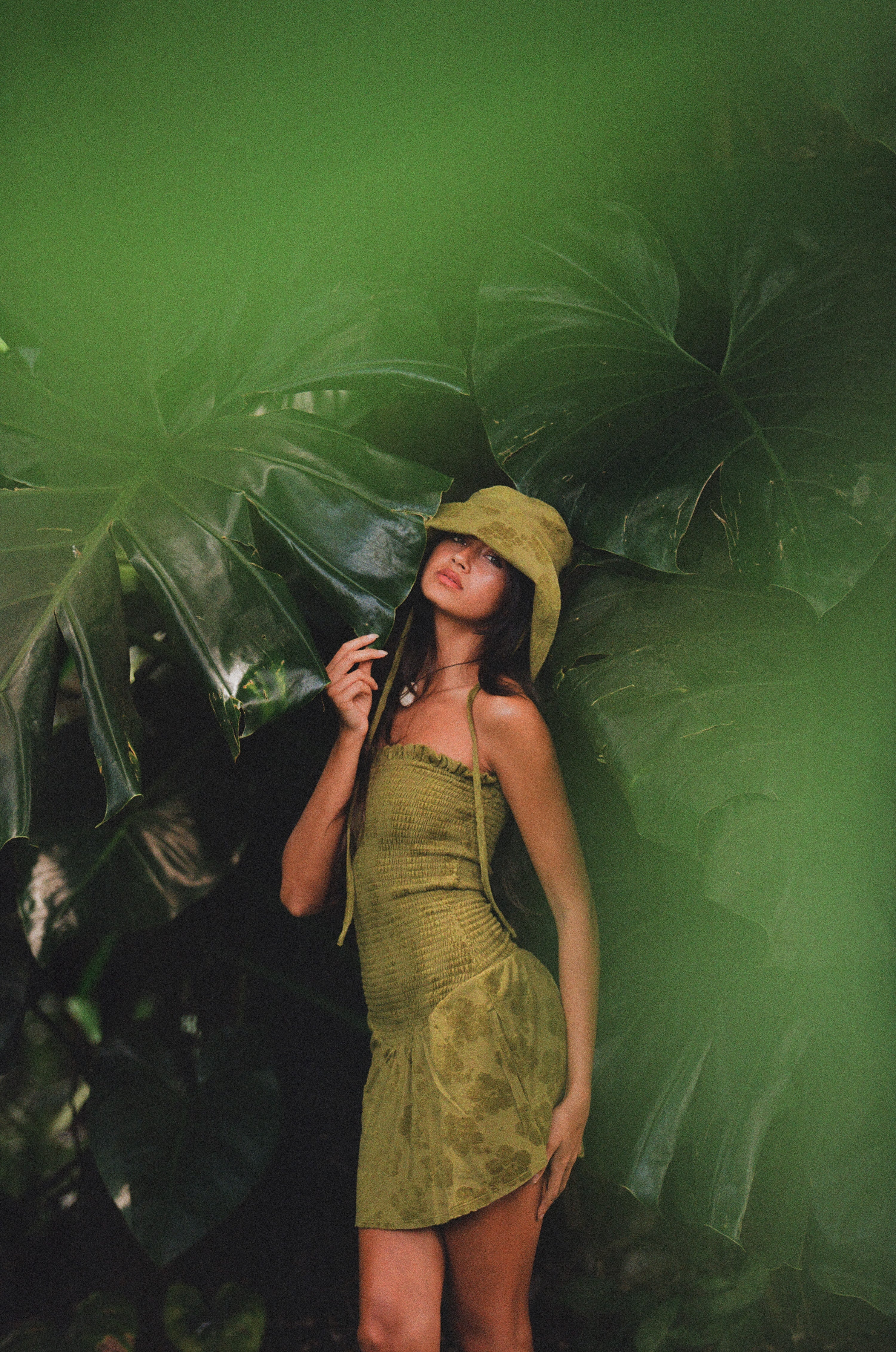 girl in matching green hat with green dress