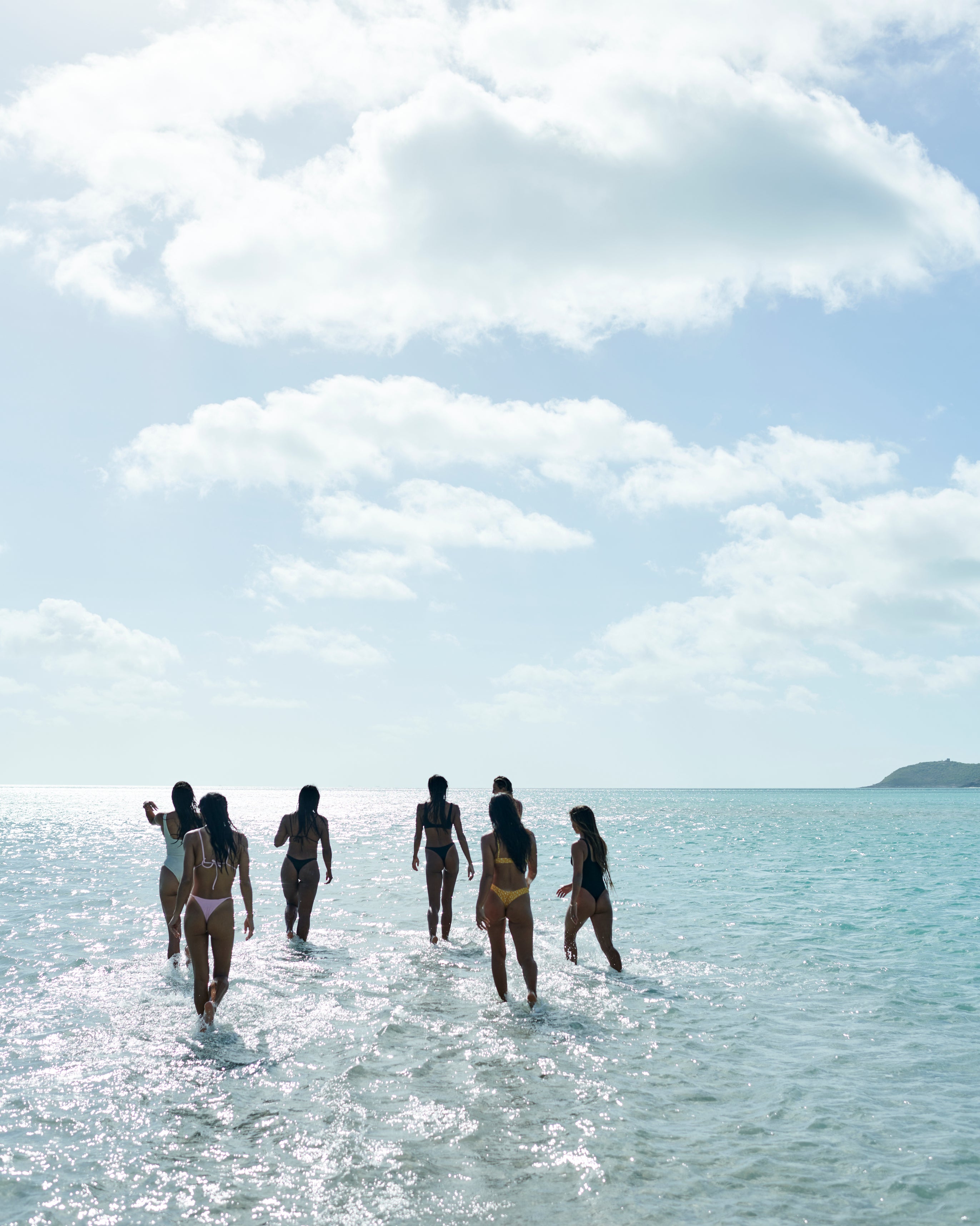 Girls going into the ocean