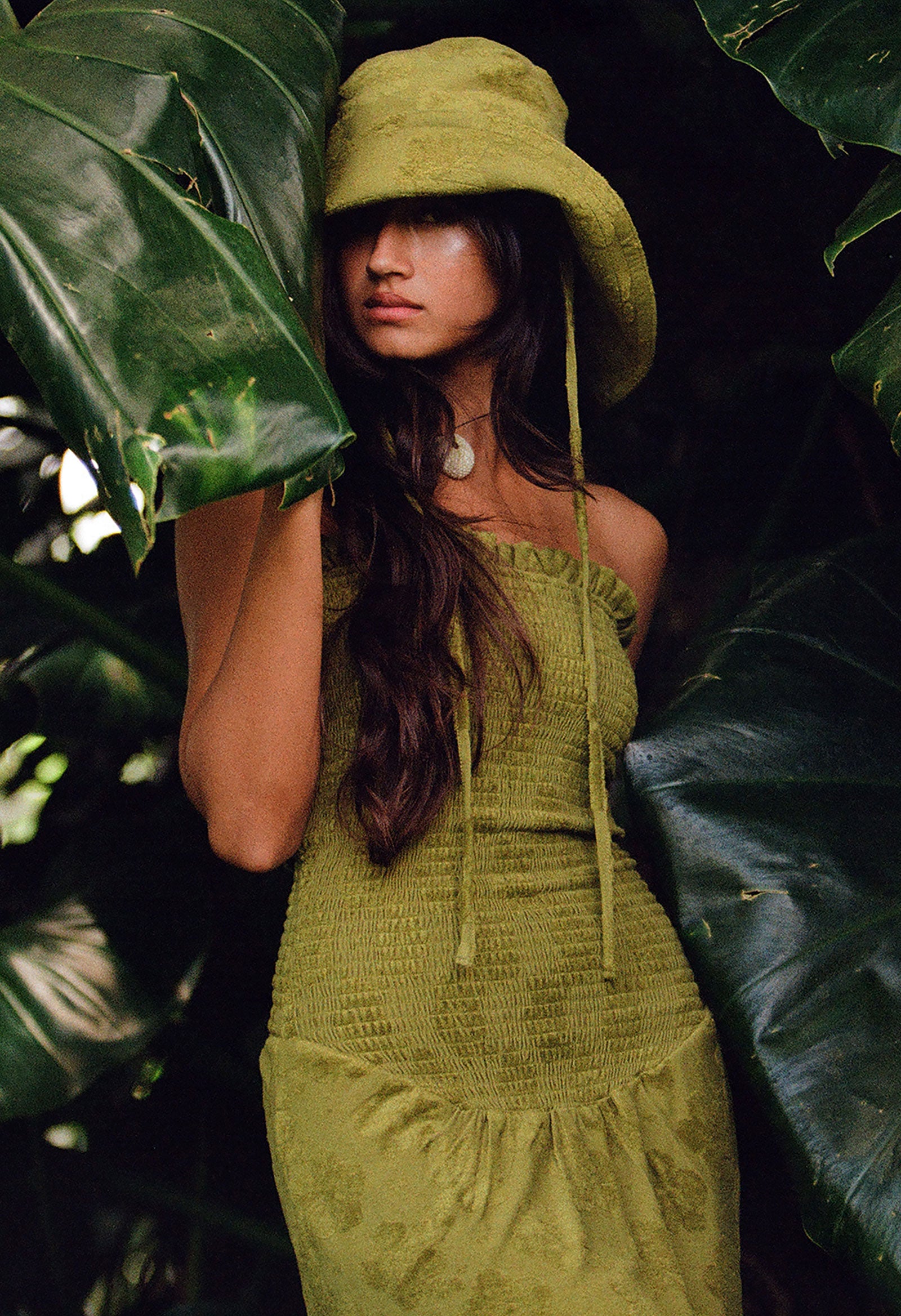 Girl in green dress and hat