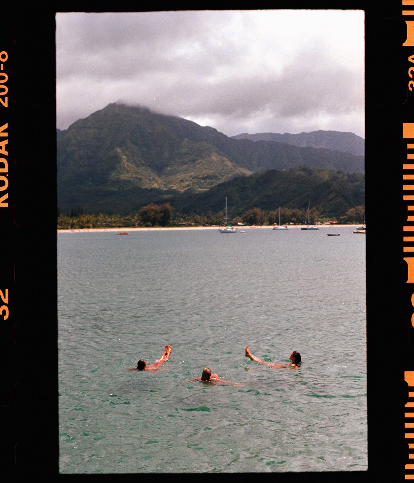 Three girls floating on their backs in the ocean